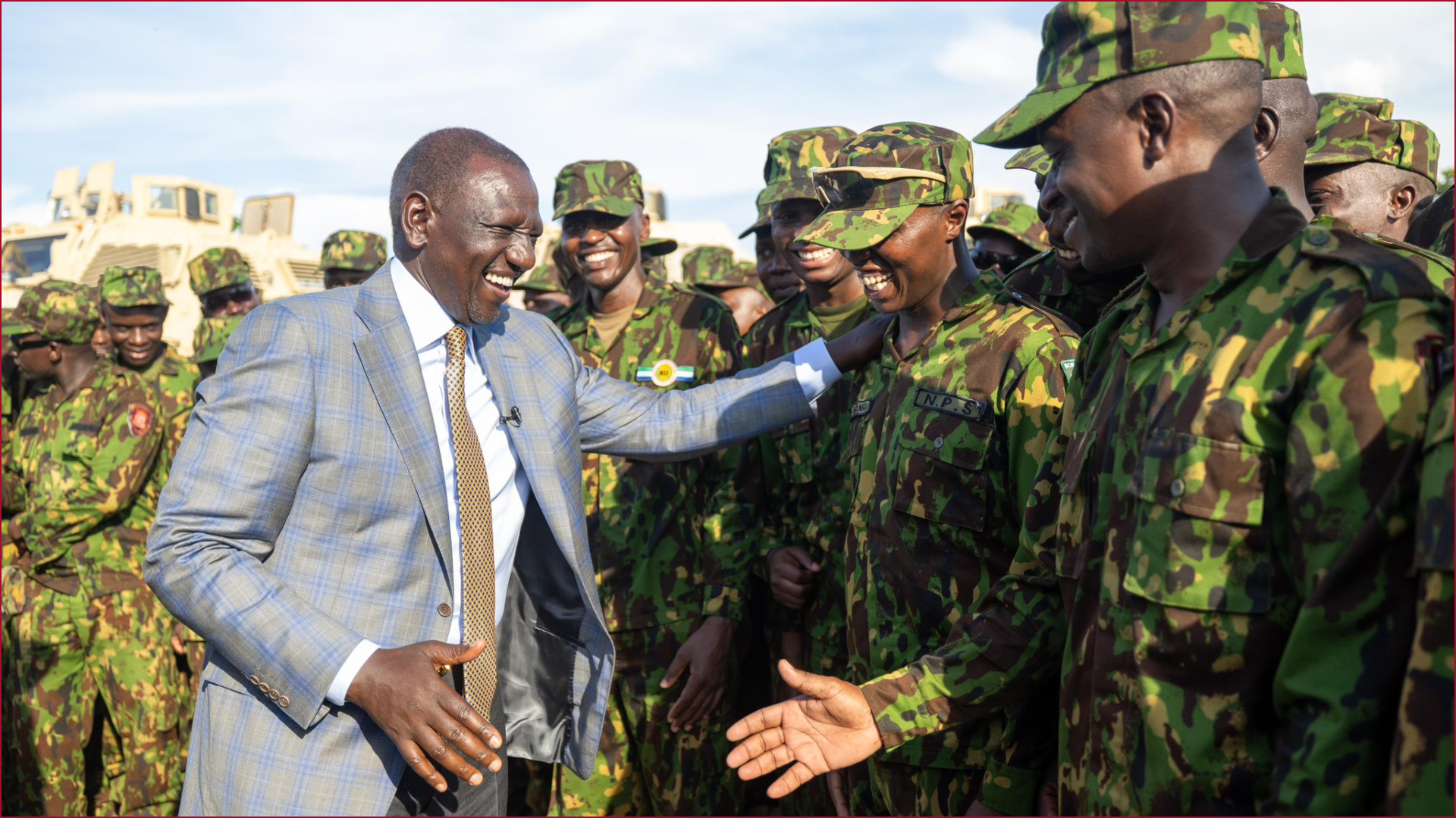 President William Ruto shares a moment with Kenyan police officers camping in Haiti's capital.